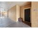Condo front door with dark wood finish and building number, offering a welcoming entry and sense of privacy at 5530 Metrowest Blvd # 9-311, Orlando, FL 32811