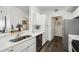Well-lit kitchen with ample counter space, modern appliances, and sleek cabinetry, providing a practical and stylish cooking area at 5530 Metrowest Blvd # 9-311, Orlando, FL 32811