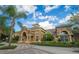 Elegant clubhouse featuring stone accents, lush landscaping, and inviting entrance, a great spot to gather with neighbors and friends at 6451 Old Park Ln # 110, Orlando, FL 32835