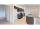 Modern kitchen featuring stainless steel appliances, granite countertops, and ample cabinet space at 6646 Rhythm Dr, Mascotte, FL 34753