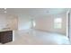 Bright and airy living room features tile flooring and large windows at 6646 Rhythm Dr, Mascotte, FL 34753