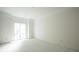 Unfinished bedroom with large window and neutral walls at 113 W Evans St, Orlando, FL 32804