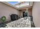 Private back patio with pavers, grill, and seating area at 1625 Reflection Cv, Saint Cloud, FL 34771