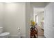 Clean bathroom with toilet and view into bedroom at 1625 Reflection Cv, Saint Cloud, FL 34771