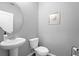 Clean and modern half bathroom with pedestal sink at 1625 Reflection Cv, Saint Cloud, FL 34771