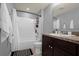 Full bathroom with tub/shower combo and dark vanity at 1625 Reflection Cv, Saint Cloud, FL 34771