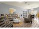 Bright living room features stylish furniture and wood-look floors at 1625 Reflection Cv, Saint Cloud, FL 34771
