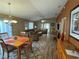Open dining room with wood table and seating for four at 1631 Edisto Ln, The Villages, FL 32162