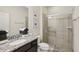 Clean bathroom with granite countertop, shower, and framed art at 2432 Tangier Dr, Kissimmee, FL 34747