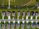 Aerial view of a neighborhood with houses and solar panels at 31771 Broadwater Ave, Leesburg, FL 34748