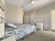 Cozy bedroom with a queen-size bed and dresser at 511 Pineloch Dr, Haines City, FL 33844