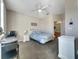 Comfortable bedroom with a full-size bed and access to a bathroom at 511 Pineloch Dr, Haines City, FL 33844