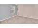 Neutral bedroom with carpet, natural light, and painted accent wall at 7642 Fairgrove Ave, Windermere, FL 34786