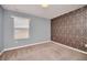 Bedroom with carpet, natural light and decorative accent wall at 7642 Fairgrove Ave, Windermere, FL 34786