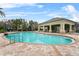 Spacious community pool with a covered seating area and plenty of space for relaxation at 7642 Fairgrove Ave, Windermere, FL 34786