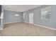 Spacious living area with tile flooring, ample natural light, and modern lighting fixture at 7642 Fairgrove Ave, Windermere, FL 34786
