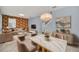 Open living space featuring modern decor, stylish furniture, and a decorative accent wall at 7642 Fairgrove Ave, Windermere, FL 34786