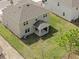 Aerial view of the home's spacious backyard and covered patio, great for outdoor activities at 1197 Happy Forest Loop, Deland, FL 32720