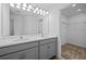 Elegant bathroom with double sink vanity, a large mirror, and access to a walk-in closet at 1197 Happy Forest Loop, Deland, FL 32720