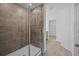 Modern bathroom with a tiled shower, glass door and elegant fixtures at 1197 Happy Forest Loop, Deland, FL 32720
