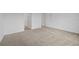 Spacious bedroom featuring neutral carpet and a crisp white trim and baseboards at 1197 Happy Forest Loop, Deland, FL 32720