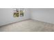 Bright bedroom featuring neutral carpet and a window with natural light at 1197 Happy Forest Loop, Deland, FL 32720