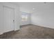 Bright living room features tile floors, a front door and a large window with natural light at 1197 Happy Forest Loop, Deland, FL 32720