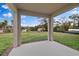 Covered patio offers outdoor living space and a view of the expansive backyard at 1197 Happy Forest Loop, Deland, FL 32720