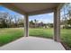 Enjoy backyard views from this covered patio, perfect for outdoor entertaining at 1197 Happy Forest Loop, Deland, FL 32720