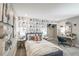 Bedroom with camera-themed wallpaper, soft carpet, and stylish decor creates a fun and inviting space at 2424 Park Ridge St, Apopka, FL 32712