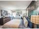 Comfortable bedroom with a nature-themed mural, light walls, dark wood furniture, and great natural light at 2424 Park Ridge St, Apopka, FL 32712