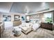 Luxurious main bedroom suite with sitting area, plush carpet, and neutral decor at 2424 Park Ridge St, Apopka, FL 32712