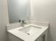 Bathroom vanity featuring a square sink with silver faucet and a stylish countertop at 1209 Alafia Way, Poinciana, FL 34759