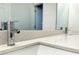 Close-up of bathroom vanity featuring a chrome faucet and a quartz countertop at 1312 Hillsborough Ct, Poinciana, FL 34759