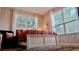 Bright bedroom with a cozy bed, soft lighting, and large windows offering a serene and inviting atmosphere at 1990 Erving Cir # 201, Ocoee, FL 34761