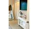 Bedroom with a console table and flatscreen TV with an open door into another bedroom at 1990 Erving Cir # 201, Ocoee, FL 34761