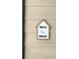 Charming 'Bless This House' sign adding a welcoming touch to the exterior siding at 1990 Erving Cir # 201, Ocoee, FL 34761