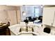 Bright kitchen featuring granite countertops, stainless sink, and open view to living area at 1990 Erving Cir # 201, Ocoee, FL 34761