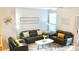 Cozy living room with gray couches, soft lighting, and stylish decor at 1990 Erving Cir # 201, Ocoee, FL 34761