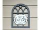 Charming wall decor with a 'Gathering is my happy place' message at 1990 Erving Cir # 201, Ocoee, FL 34761
