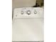 Close-up of a clean, white GE washing machine highlighting water levels, and temperature options at 1990 Erving Cir # 201, Ocoee, FL 34761