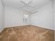 Empty bedroom featuring a ceiling fan, a window and closet at 20505 Queen Alexandra Dr, Leesburg, FL 34748
