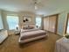 Bright bedroom featuring a king-size bed and ample natural light at 20505 Queen Alexandra Dr, Leesburg, FL 34748
