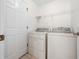 Bright laundry room with washer and dryer at 20505 Queen Alexandra Dr, Leesburg, FL 34748