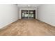Spacious living room with carpet and sliding doors at 20505 Queen Alexandra Dr, Leesburg, FL 34748