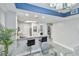 Open kitchen with breakfast bar, grey cabinets, and a view into the living and dining area at 13427 Blue Heron Beach Dr # 405, Orlando, FL 32821