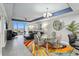 Stylish living room with modern decor, leather sofa, glass dining table, and scenic view at 13427 Blue Heron Beach Dr # 405, Orlando, FL 32821
