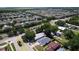High aerial shot of a neighborhood with beautiful landscaping and diverse home styles at 4316 Natchez Trace Dr, St Cloud, FL 34769