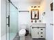 Modern bathroom featuring a glass-enclosed shower, updated vanity with modern fixtures, and neutral tones at 4316 Natchez Trace Dr, St Cloud, FL 34769