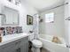 Bright bathroom with a shower-tub combo, decorative tiles and a gray vanity with stylish accents at 4316 Natchez Trace Dr, Saint Cloud, FL 34769